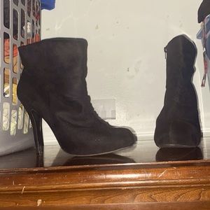 Black heeled boots. Brand is codify.